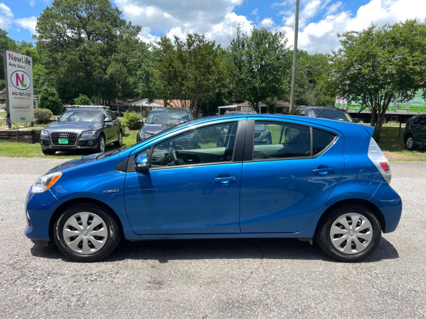 2013 BLUE TOYOTA PRIUS C ONE (JTDKDTB34D1) with an 1.5L engine, Continuously Variable transmission, located at 5103 Dorchester Rd., Charleston, SC, 29418-5607, (843) 767-1122, 36.245171, -115.228050 - Photo#3